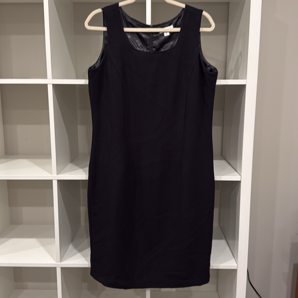 Used, excellent condition: Joan Rivers black sleeveless dress, size M.